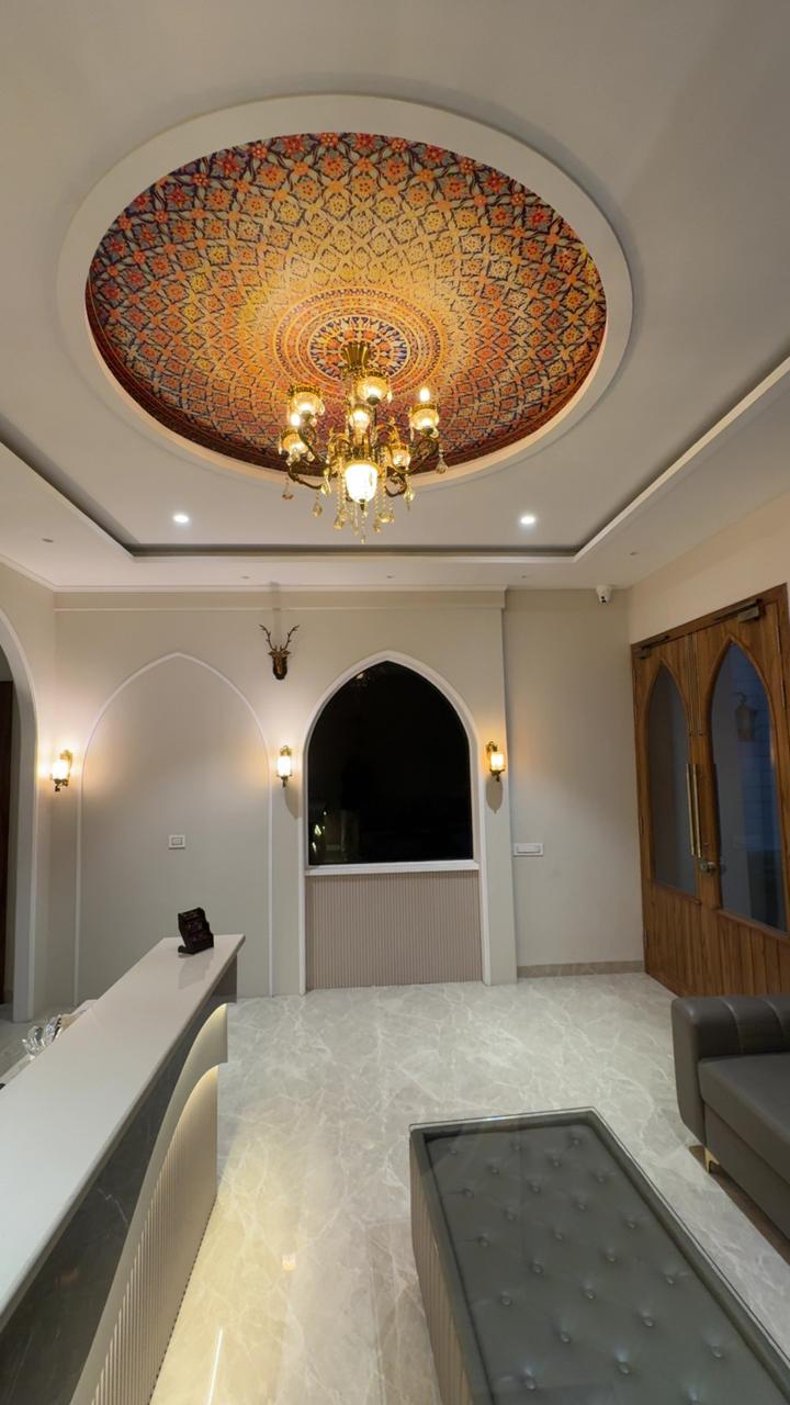THE ROYAL KING luxury hotel lobby in Ludhiana with ornate chandelier and marble interiors